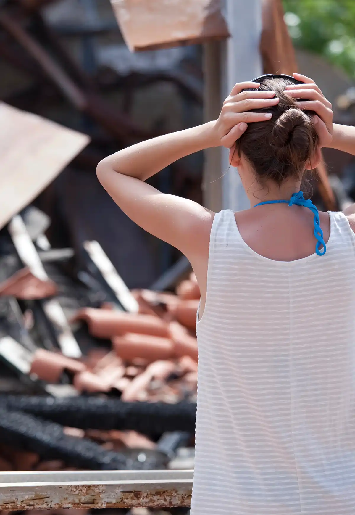 Woman Staring at Destroyed Home Woman Staring at Destroyed Home